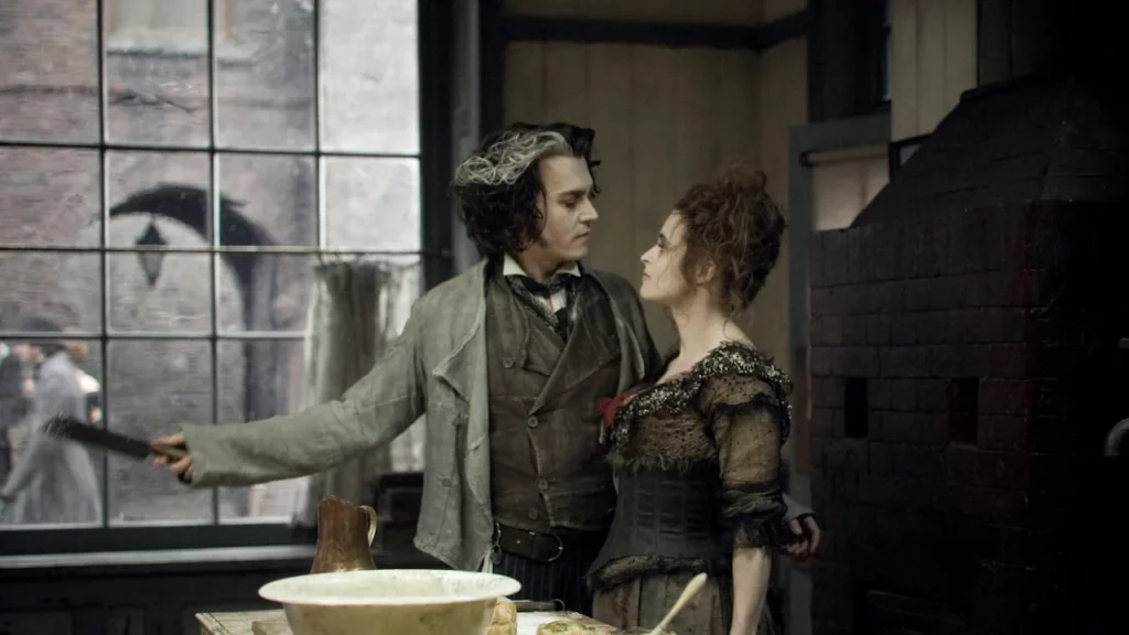 Johnny Depp e Helena Bonham Carter em "Sweeney Todd: O Barbeiro Demoníaco da Rua Fleet" (Foto: Reprodução)